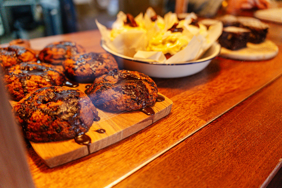 Chocolate Chip cookes, and other bowls of food on a counter.